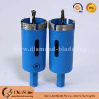 Central diamond hole saw with removal pilot bit for drilling concrete and stone