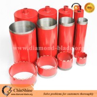 Long diamond core drilling bits for reinforced concrete